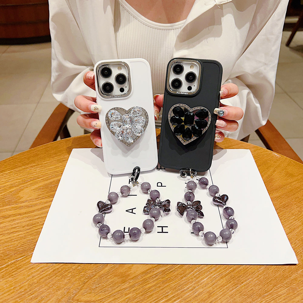 Stone Heart Shape Stand Silicone Soft Phone Cover with Bracelet - iPhone 16 Plus